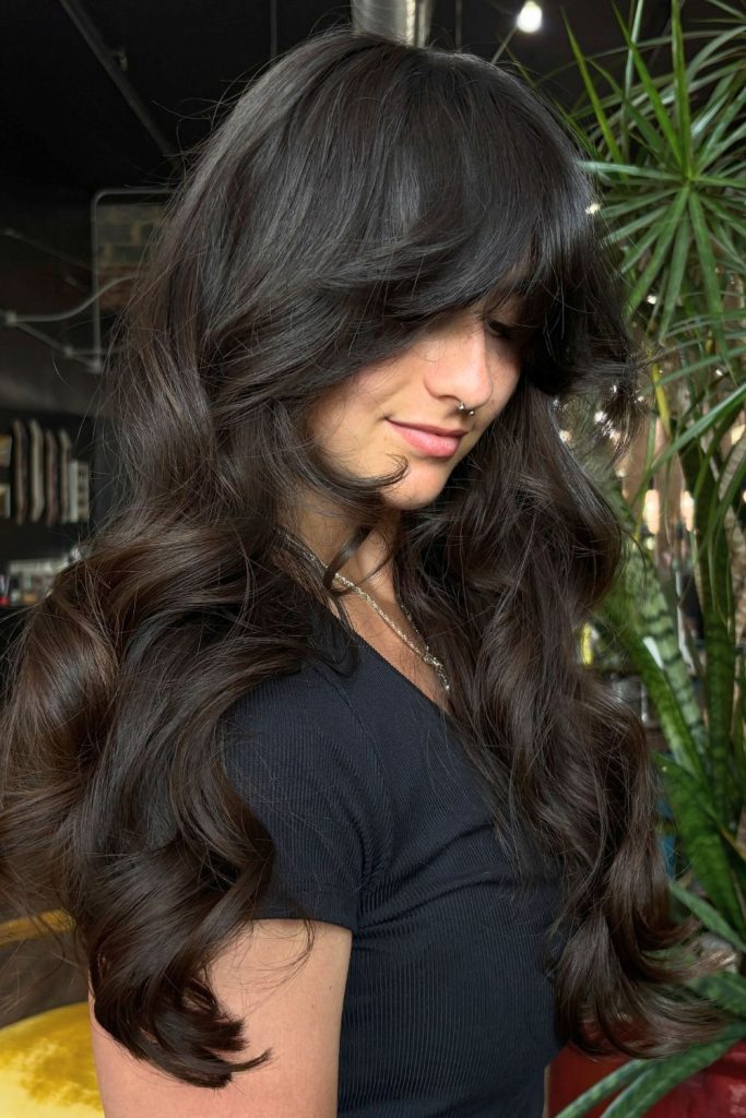 Feathered ’70s Layers With Swoop Bangs