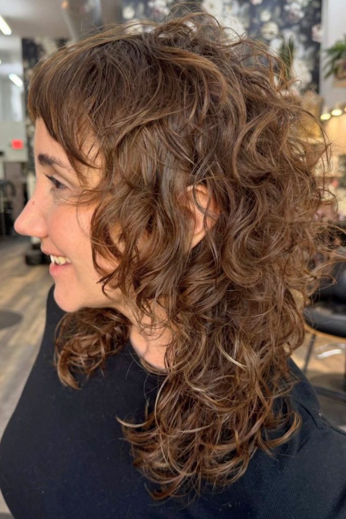Curly Wolf Cut With Curtain Bangs