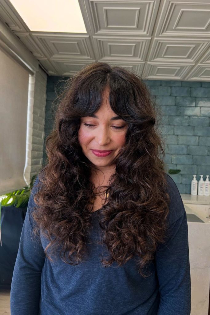 Layered Curly Hair With Curtain Bangs