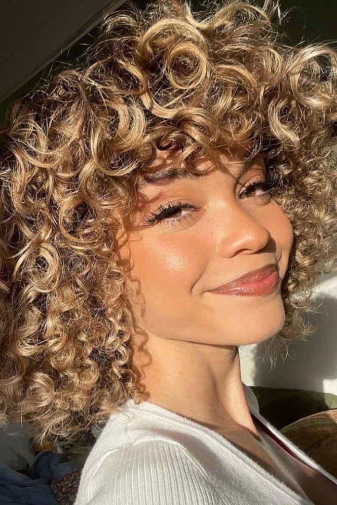 Short Curly Haircut With Bangs